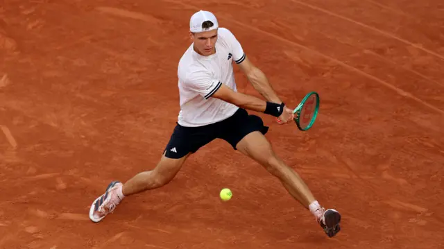 Jakub Mensik hits a backhand