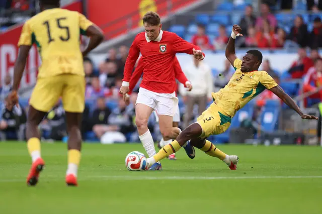Ghana's Thomas Partey (right) fouls Wales' David Brooks