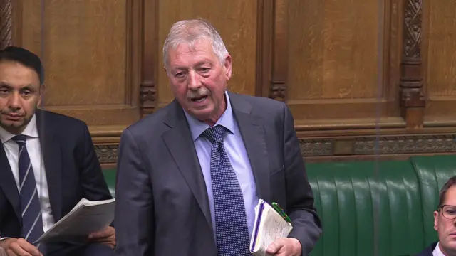 Sammy Wilson stands in the House of Commons
