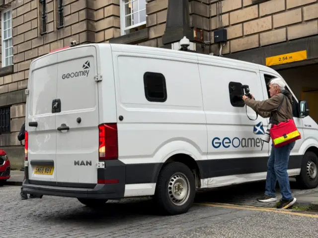 Peter Murrell leaves the court in the back of a white van