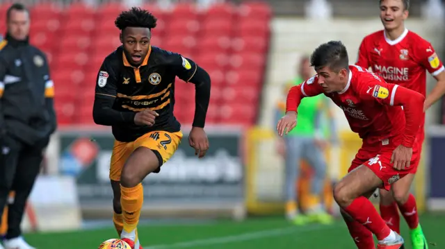 Antoine Semenyo runs with the ball for Newport County