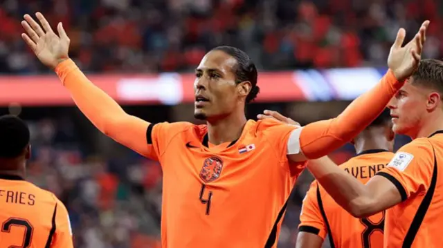 Virgil van Dijk with arms outstretched