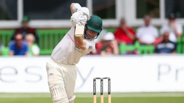 Nick Kelly hits a cover drive for Leicestershire against Yorkshire