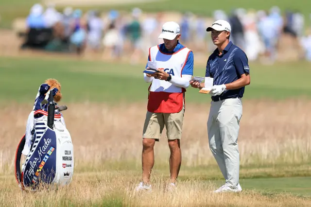 Collin Morikawa and his caddie in the undergrowth