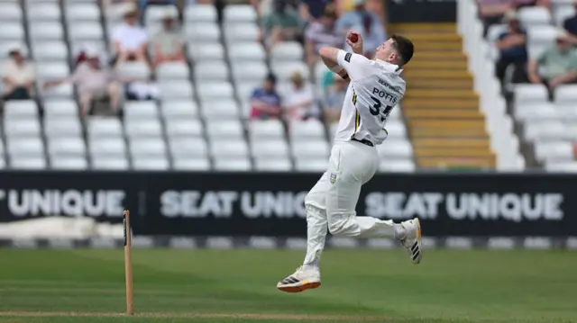 Matthew Potts bowling for Durham