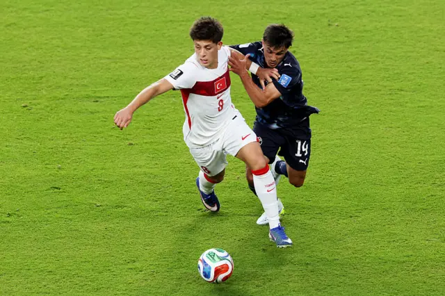 Arda Guler #8 of Turkiye is challenged by Andres Cubas #14 of Paraguay during the FIFA World Cup 2026 Group D match between Türkiye and Paraguay