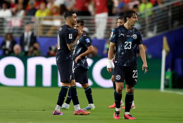Miguel Almiron #10 of Paraguay reacts after receiving a red card for covering his mouth while talking to another player during the FIFA World Cup 2026 Group D match between Türkiye and Paraguay