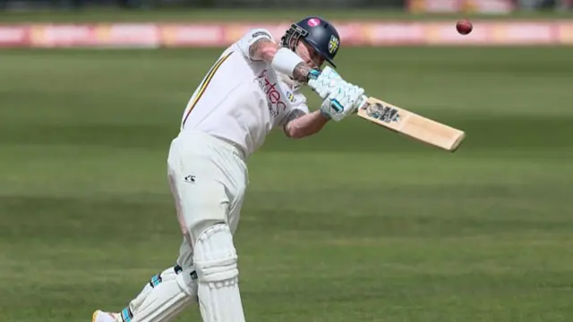 Ben Stokes hits the ball over the top for four