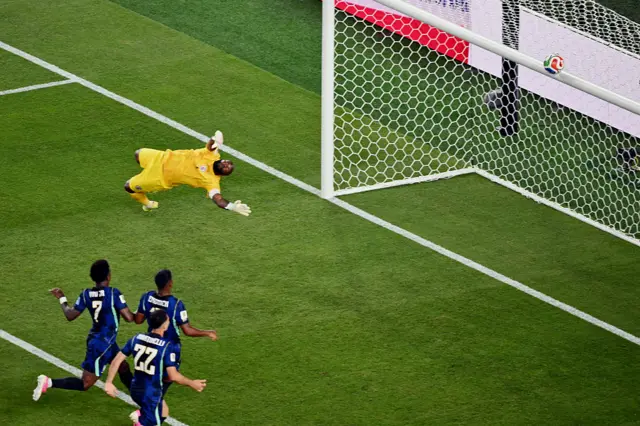 Haiti's goalkeeper #01 Johny Placide eyes on the ball during the 2026 World Cup Group C football match between Brazil and Haiti at the Philadelphia Stadium in Philadelphia