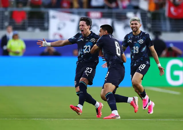 Matias Galarza #23 of Paraguay celebrates with teammates after scoring the team's first goal during the FIFA World Cup 2026 Group D match between Türkiye and Paraguay