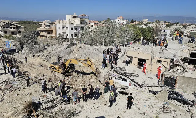 Civil defense teams conduct search and rescue operations in the rubble of destroyed buildings after an Israeli airstrike target the town of Qanarit, despite the ceasefire and the U.S.-Iran agreement, on June 20, 2026, in Sidon, Lebanon