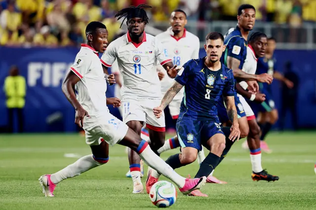 Haiti's midfielder #17 Danley Jean Jacques and Brazil's midfielder #08 Bruno Guimaraes fight for the ball during the 2026 World Cup Group C football match between Brazil and Haiti