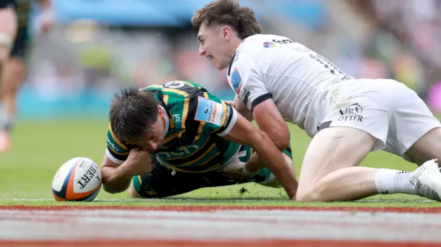 Alex Mitchell loses the ball