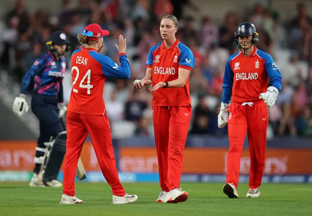 Freya Kemp celebrates a wicket with Charlie Dean