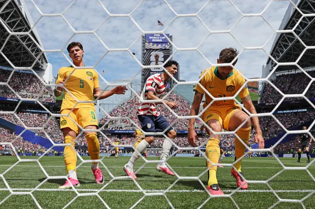Cameron Burgess of Australia reacts after scoring an own goal