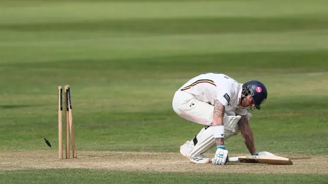 Ben Stokes on his knees after being bowled