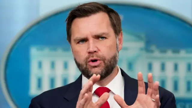 JD Vance speaking at a press conference in the White House