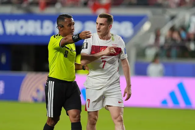 Kerem Akturkoglu (7) of Turkiye talks to the referee Ivan Arcides during the 2026 FIFA World Cup First Stage Group D match between Turkiye and Paraguay at the San Francisco Bay Area Stadium