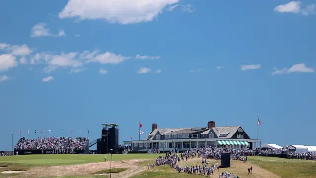 A general view of the clubhouse framed against a blue sky