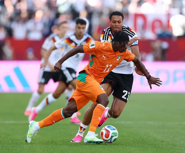 Yan Diomande controls the ball against Felix Nmecha