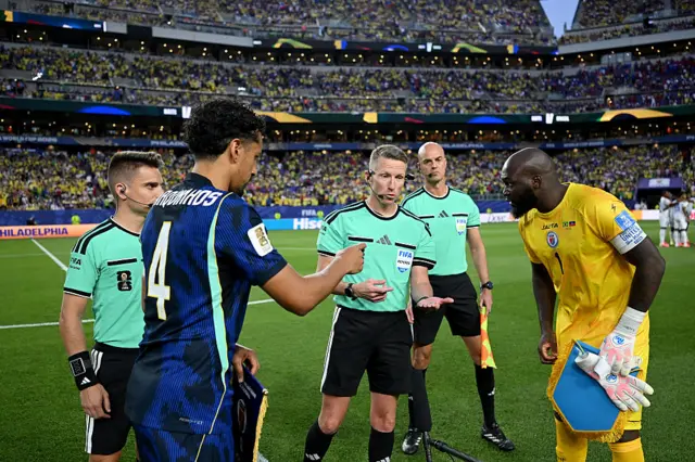 Referee Alejandro Hernandez conducts the coin toss between Marquinhos #4 of Brazil and Johny Placide #1 of Haiti during the FIFA World Cup 2026 Group C match between Brazil and Haiti