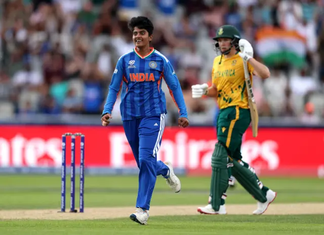Shree Charani of India celebrates taking the wicket of Laura Wolvaardt of South Africa during the ICC Women's T20 World Cup Group A match between South Africa and India at Old Trafford Cricket Ground