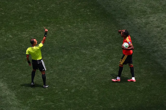 Nathan Ngoy of Belgium receives a red card