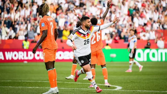 Deniz Undav celebrates as Ivory Coast players look stunned