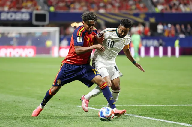 Lamine Yamal of Spain and Salem Aldawsari #10 of Saudi Arabia compete for the ball