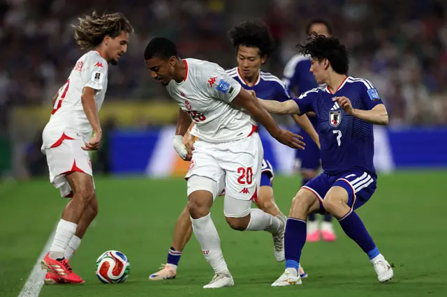 Tunisia's defender #20 Yan Valery and Japan's midfielder #07 Ao Tanaka fight for the ball during the 2026 World Cup Group F football match between Tunisia and Japan at the Monterrey Stadium