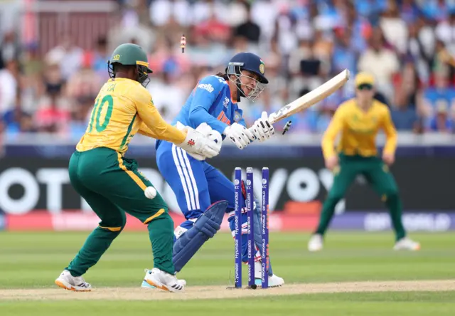 Smriti Mandhana of India is bowled by Marizanne Kapp of South Africa during the ICC Women's T20 World Cup Group A match between South Africa and India at Old Trafford Cricket Ground