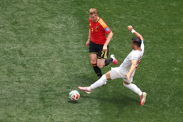 Kevin De Bruyne and Iran's defender Ehsan Hajsafi fight for the ball