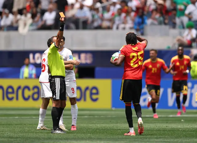 Nathan Ngoy of Belgium receives a red card
