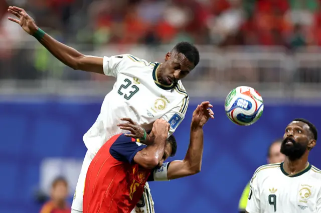 Rodri of Spain is challenged by Mohamed Kanno