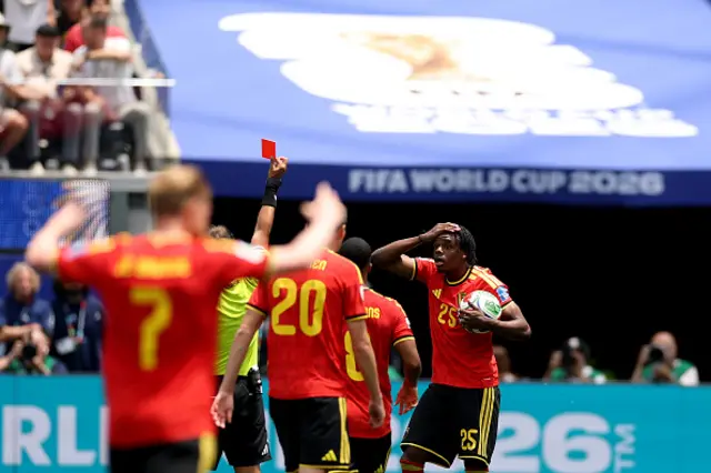 Nathan Ngoy #25 of Belgium receives a red card