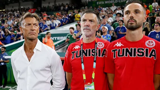New Tunisia head coach Herve Renard, left, with two of his backroom staff, takes charge of the team for the first time in their 4-0 defeat to Japan