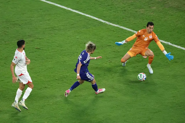 Junya Ito #14 of Japan scores his team's third goal past Aymen Dahmen #16 of Tunisia during the FIFA World Cup 2026 Group F match between Tunisia and Japan