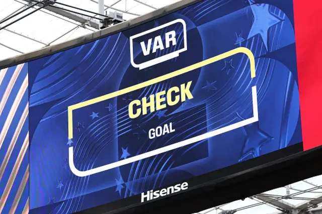 The big screen displays the VAR review