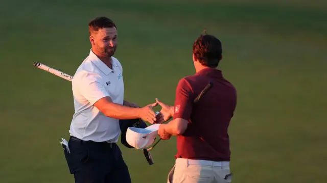 Wyndham Clark shakes hands with Matt Fitzpatrick