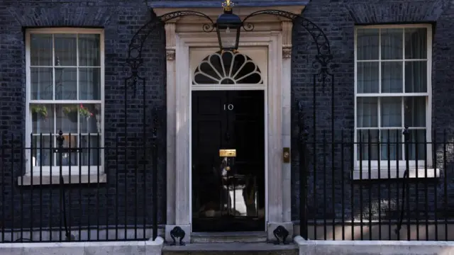 The door to Number 10 Downing Street on a sunny day.