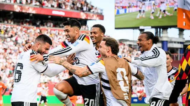 Germany players celebrate with match winner Undav