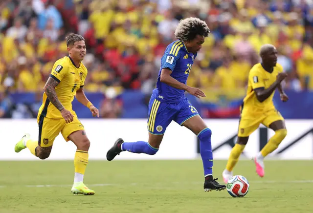 Tahith Chong #21 of Curacao controls the ball under pressure from Jordy Alcivar #5 of Ecuador during the FIFA World Cup 2026 Group E match between Ecuador and Curacao