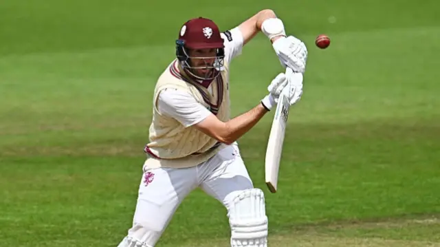 Craig Overton pushes at the ball
