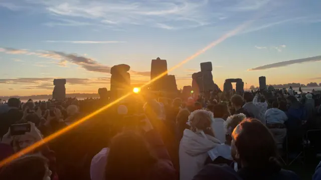 The sun shines through the rocks at Stonehenge