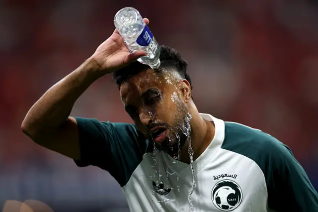 Salem Aldawsari of Saudi Arabia pours water