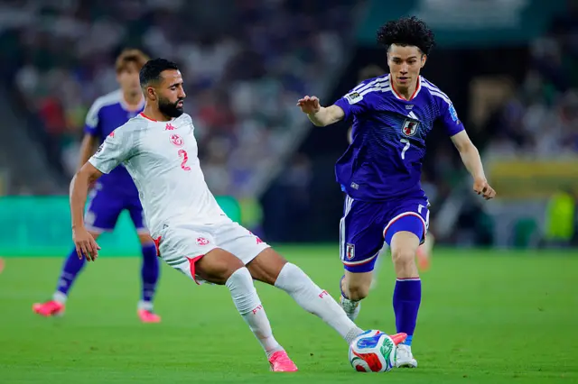 Ali Abdi (L) of Tunisia and Ao Tanaka (R) of Japan fight for the ball during the FIFA World Cup 2026 Group F match between Tunisia and Japan at Monterrey Stadium on June 20, 2026 in Monterrey, Mexico. (Photo by Luis Cano/Jam Media/Getty Images)