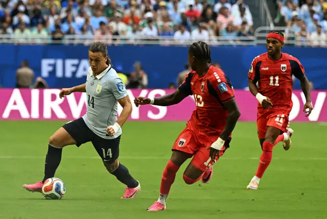 Agustin Canobbio and Cape Verde's defender #13 Sidney Lopes Cabral fight for the ball during the 2026 World Cup Group H football match between Uruguay and Cape Verde