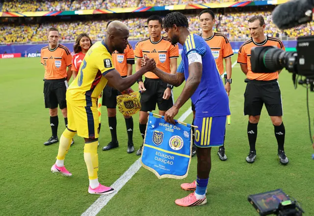 Enner Valencia #13 of Ecuador and Leandro Bacuna #10 of Curacao shake hands before the FIFA World Cup 2026 Group E match between Ecuador and Curacao at Kansas City Stadium