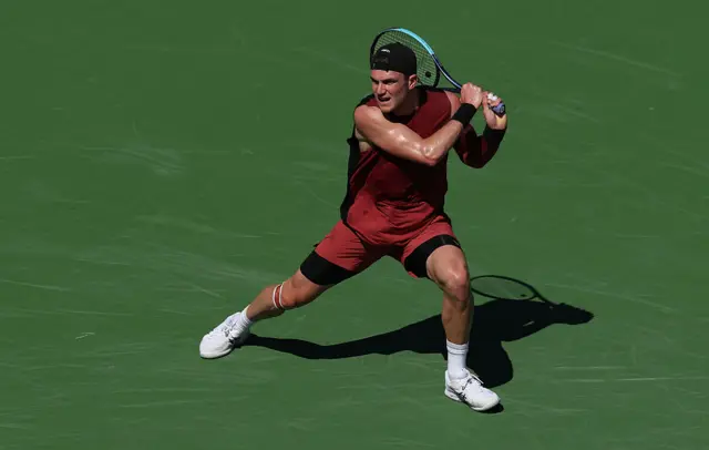 Jack Draper of Great Britain plays a backhand