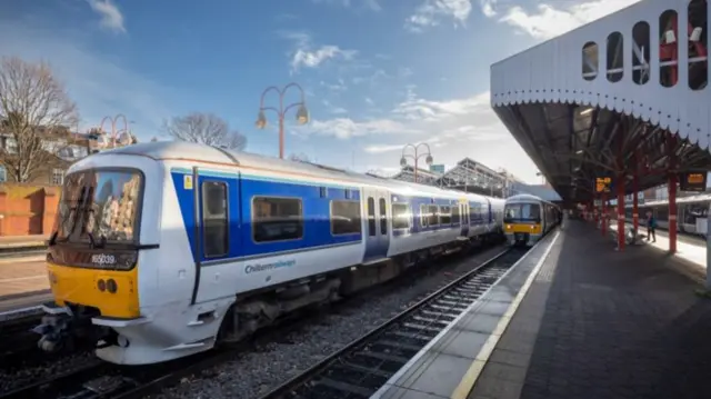 Chiltern Railways trains at a station.